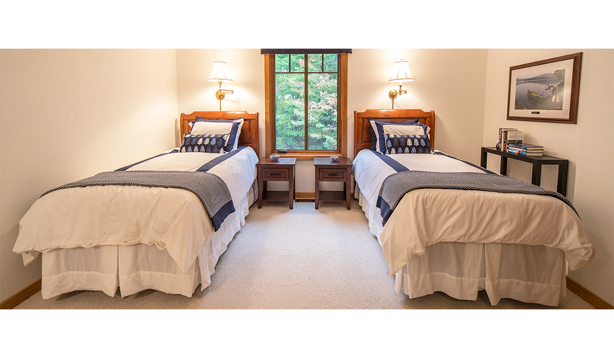 Clean and inviting second bedroom with twin beds for the kids.