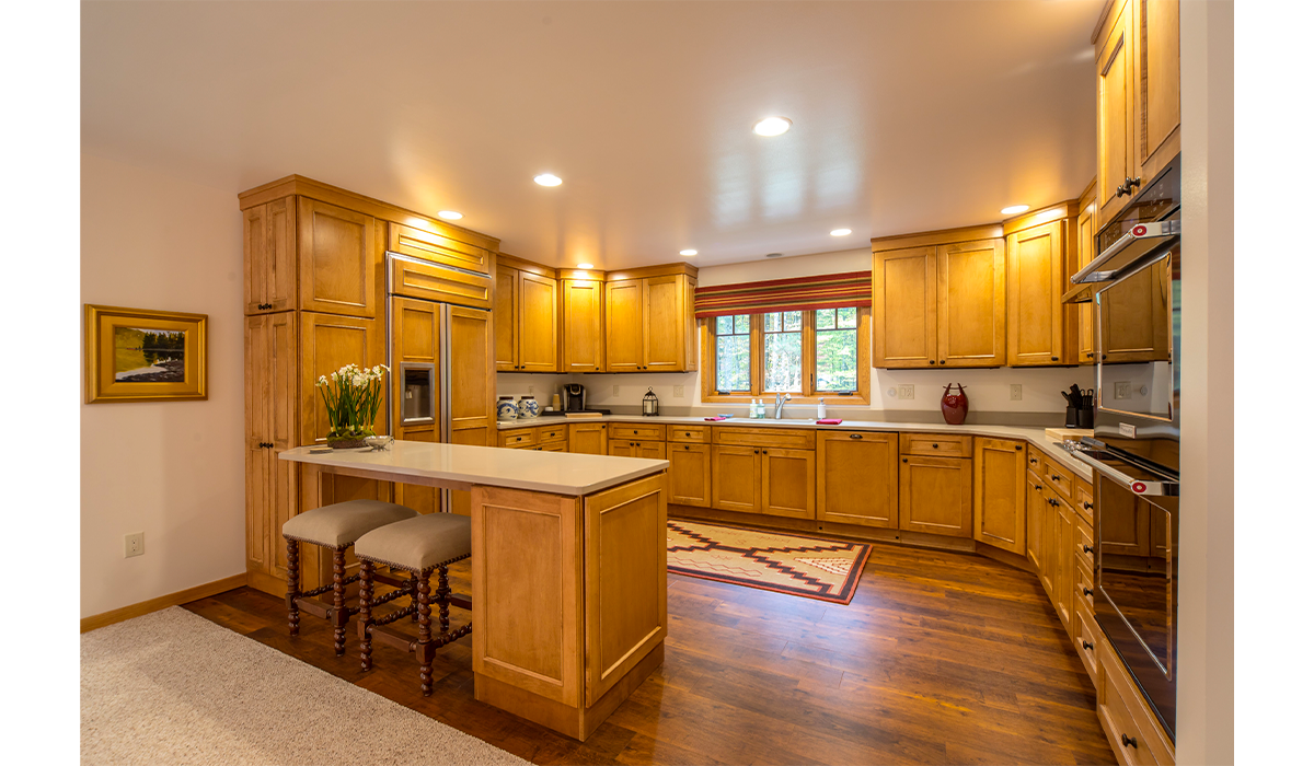 Home cooks will love the double oven and breakfast bar.