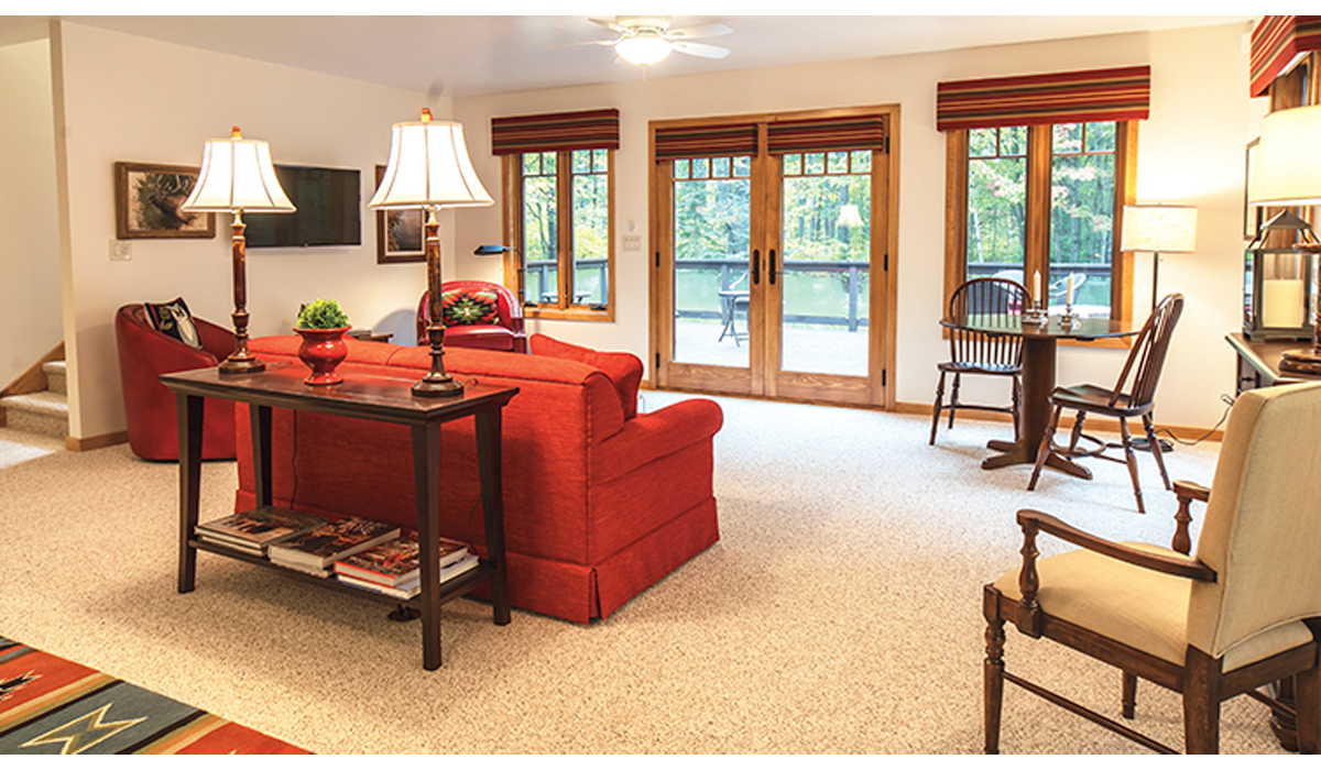 Living room faces the patio with views of the Northwoods.