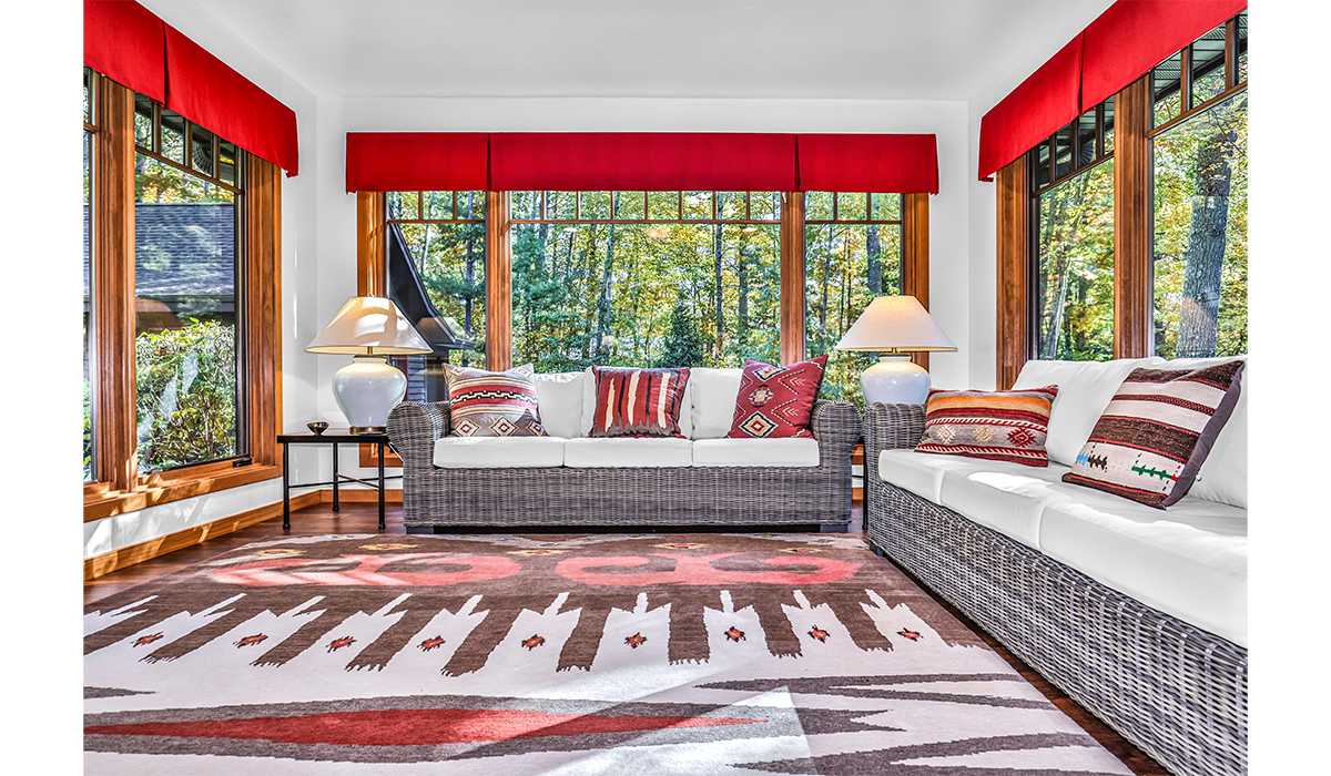 Enjoy the sunshine, snowflakes or fall colors in the cozy sunroom.
