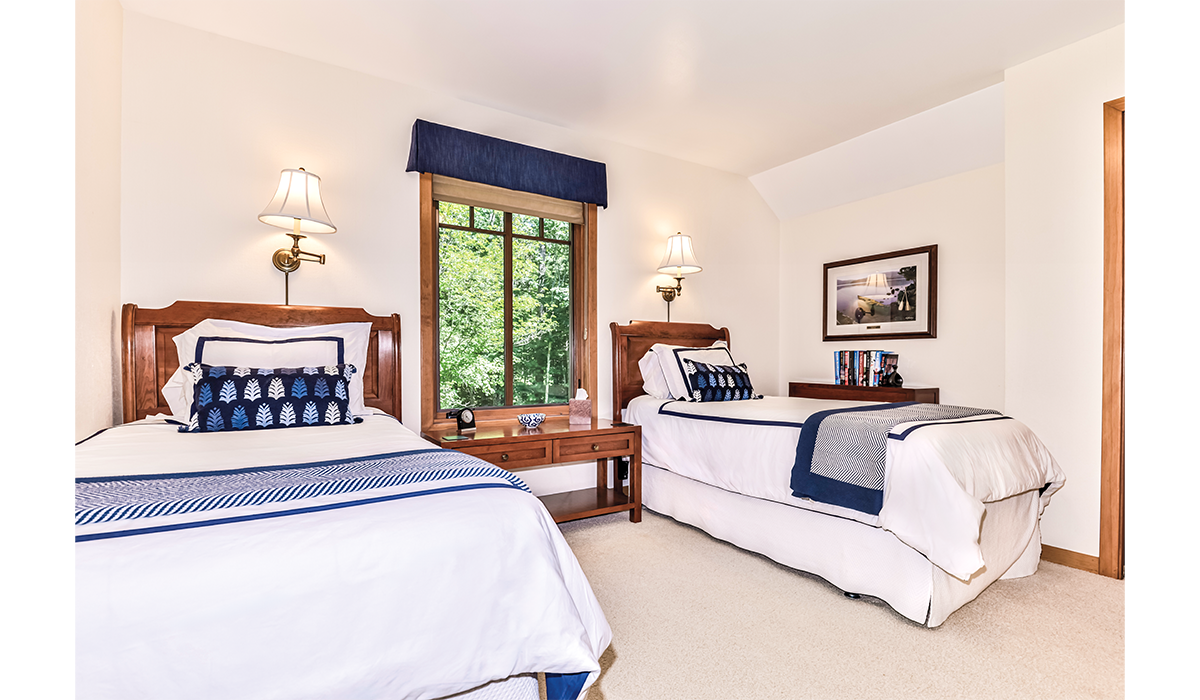 Clean and inviting third bedroom with twin beds for the kids.