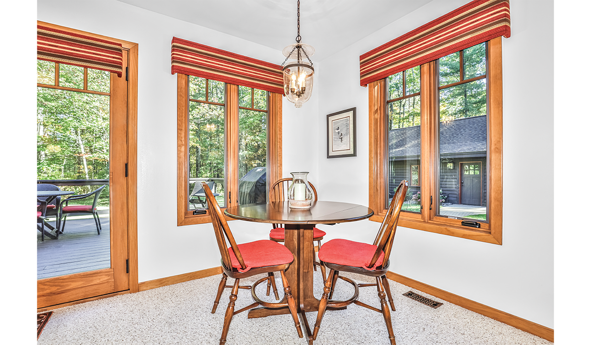 Cozy eating areas in the living room and sunroom.