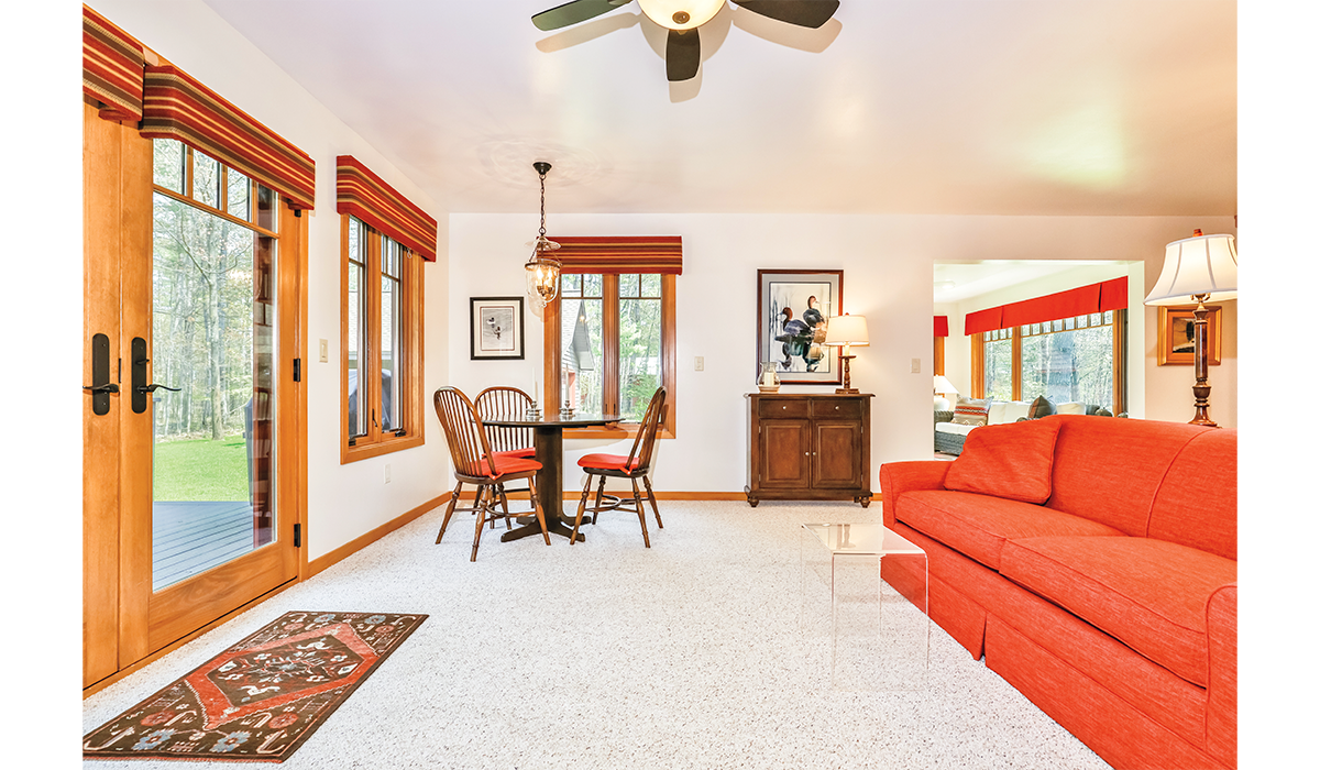 Living room faces the patio with views of the Northwoods.
