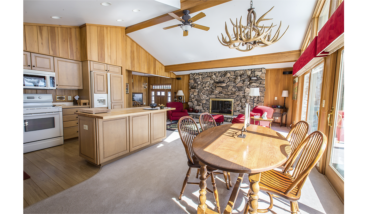 Open concept living area with fireplace and beautiful views.