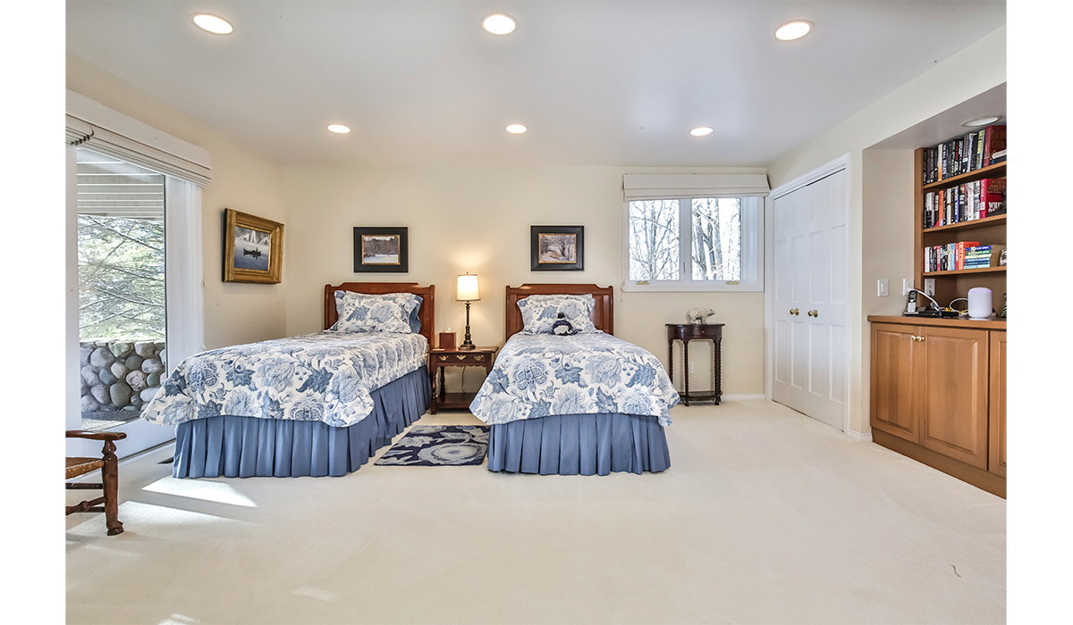 Additional bedroom features two twin beds for the kids.