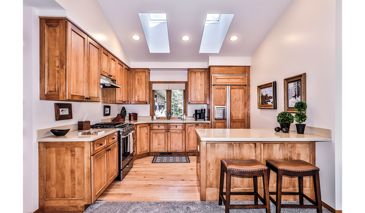 Bright, fully equipped kitchen with breakfast bar.