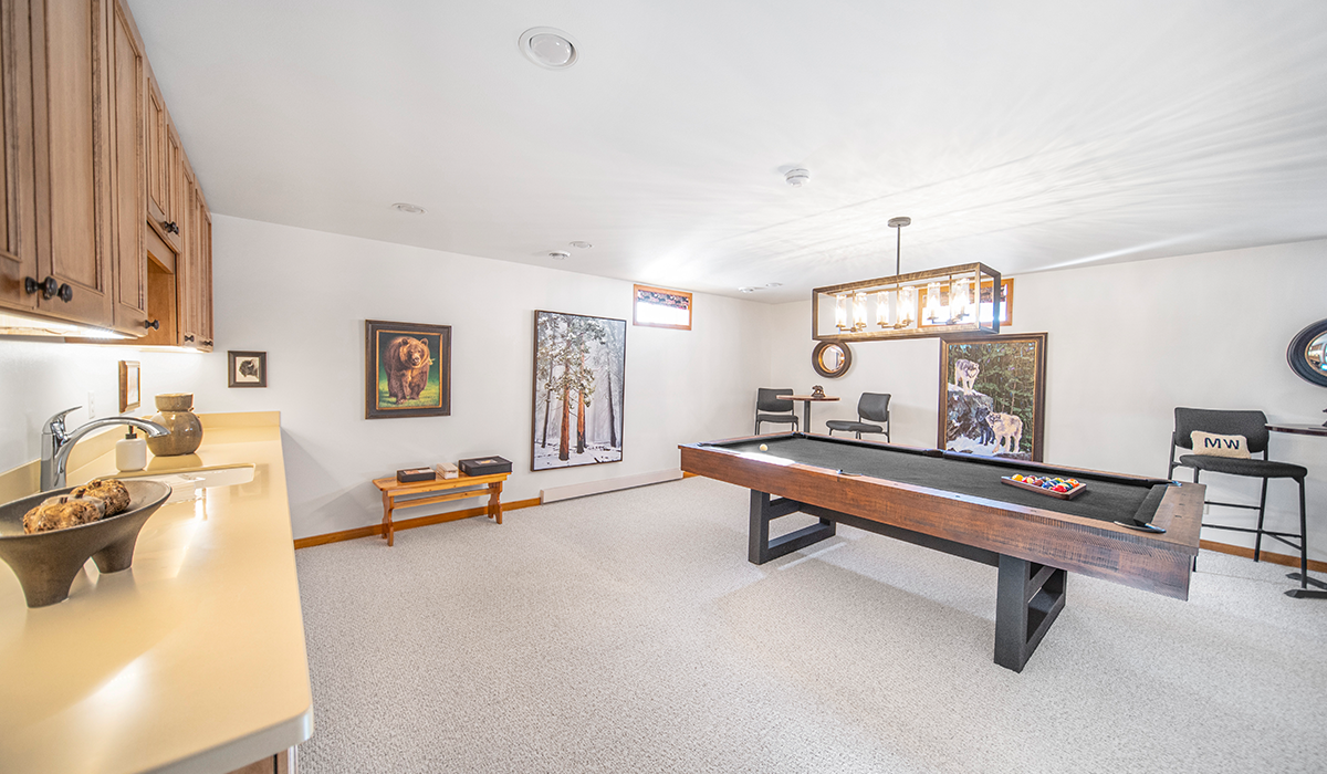Finished, walkout basement with pool table and wet bar.