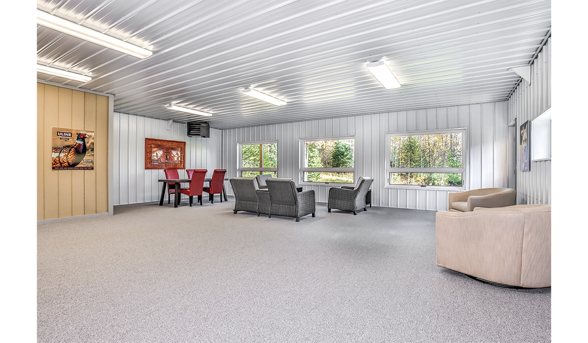 Large, heated garage with comfortable gathering area.