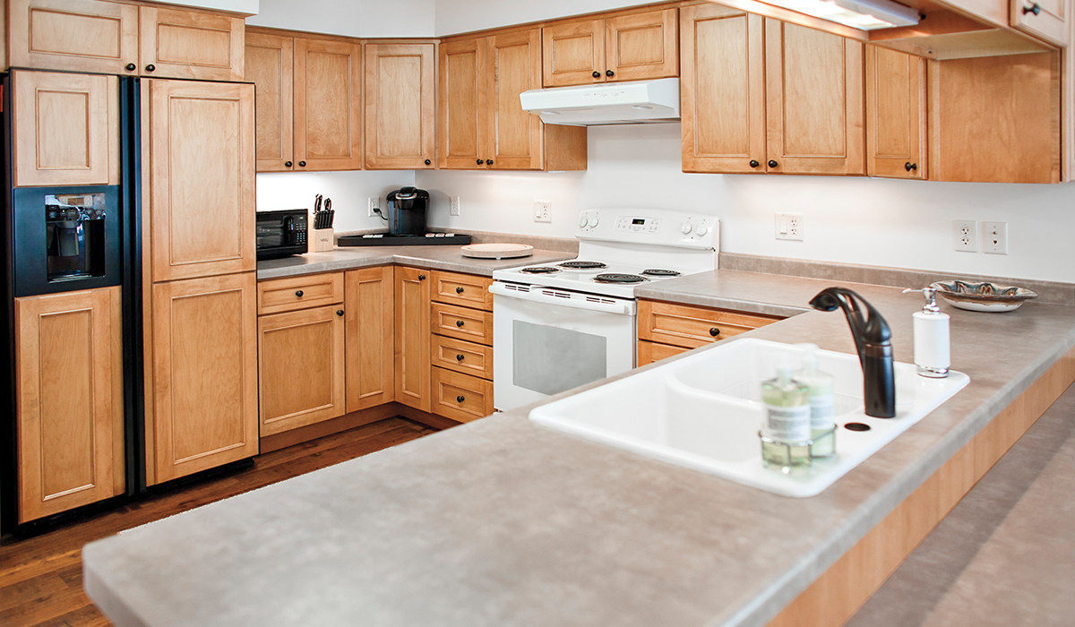 A full kitchen provides ample room for cooking and entertaining.