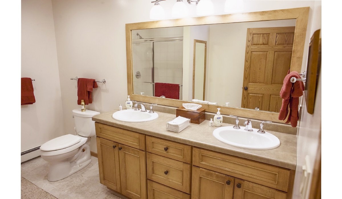 Roomy bathrooms with his and hers sinks and full-size mirror.
