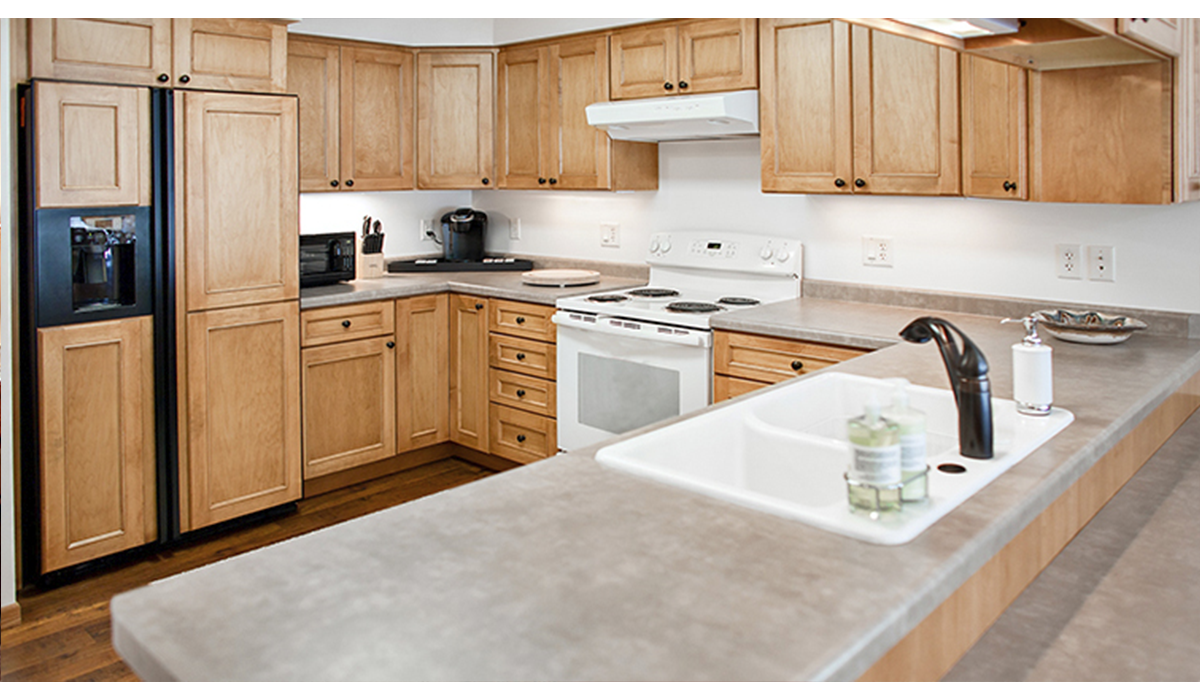 A full kitchen provides ample room for cooking and entertaining.