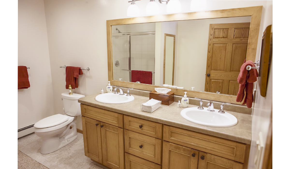 Roomy bathrooms with his and her sinks and full-size mirror.