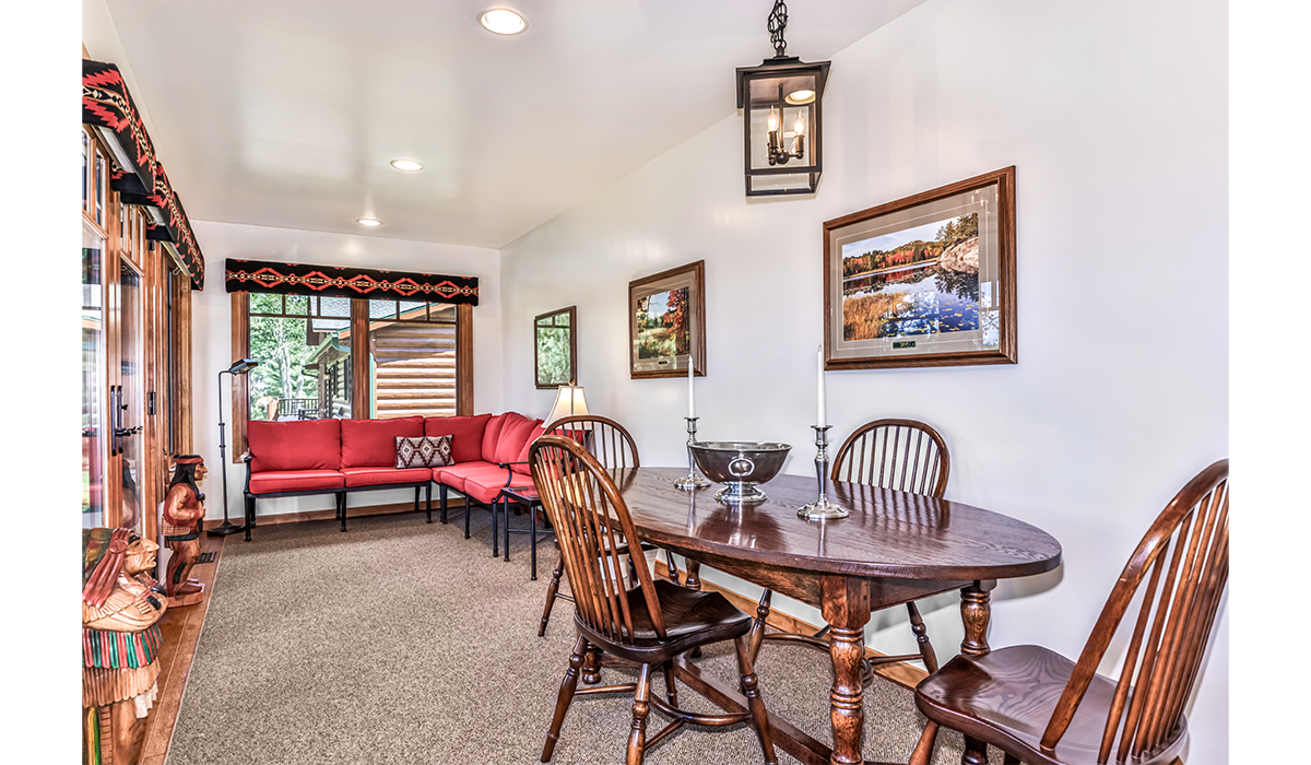 Spacious dining and lounge area with beautiful lake views.