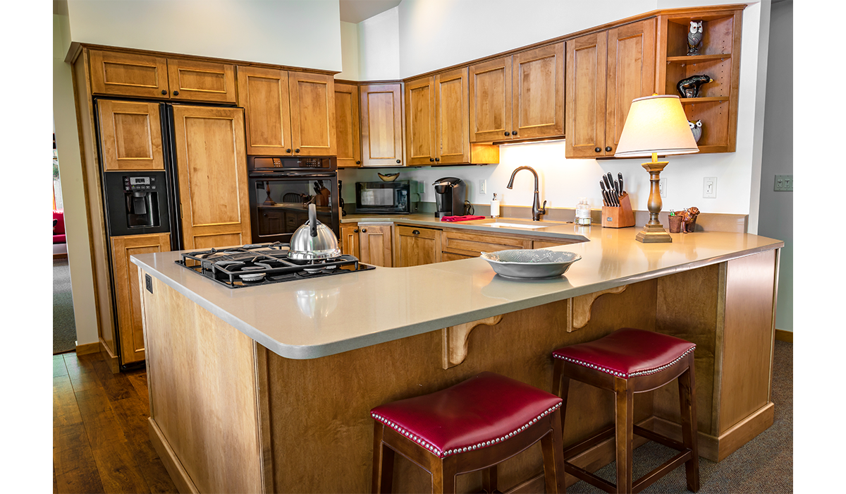 A full kitchen provides ample room for cooking and entertaining.